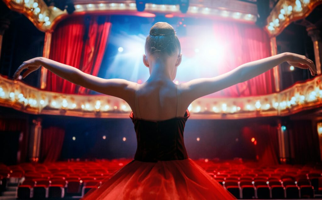 girl in a red tutu dancing on the stage